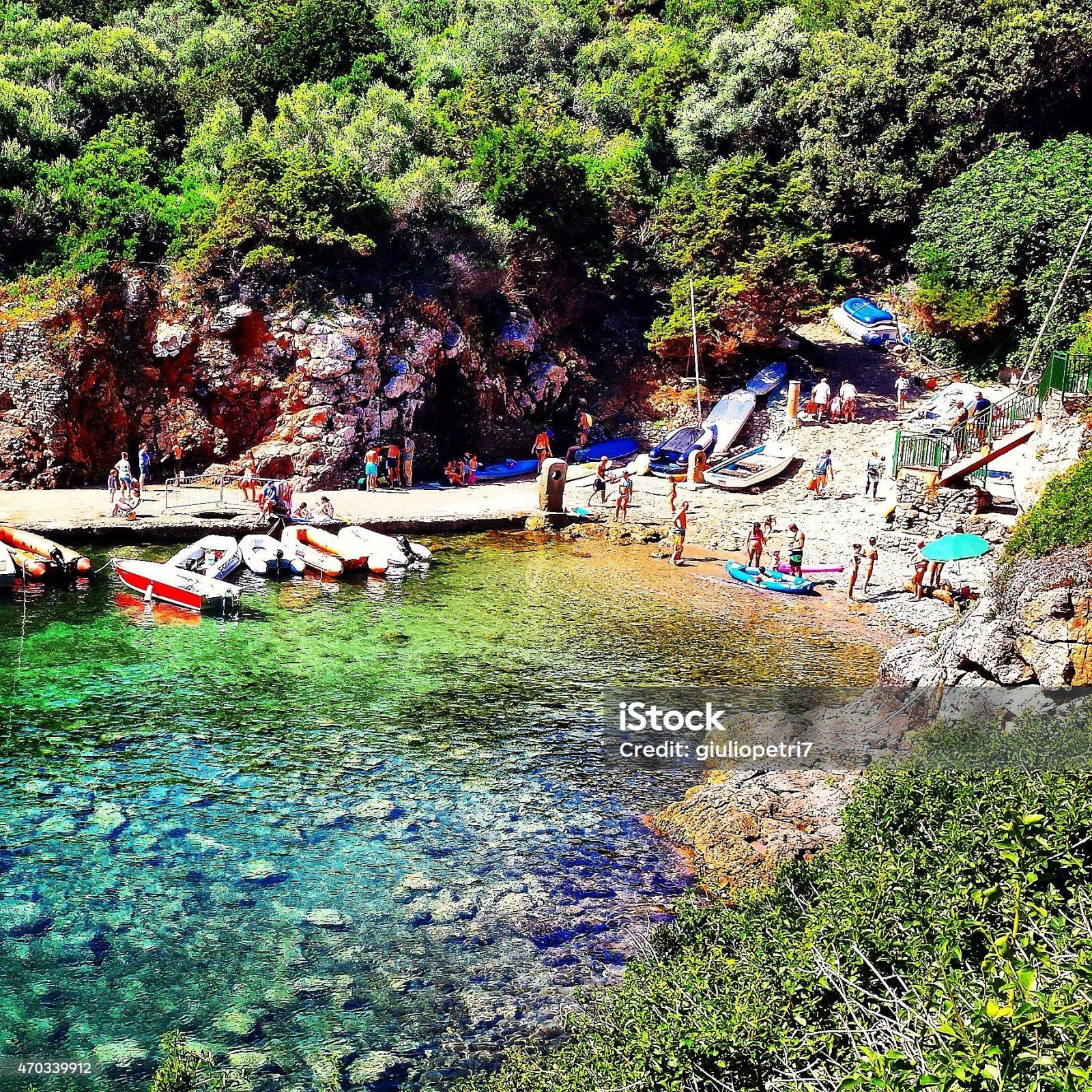A beautiful stone beach that opens between cliffs of the island of Giannutri.